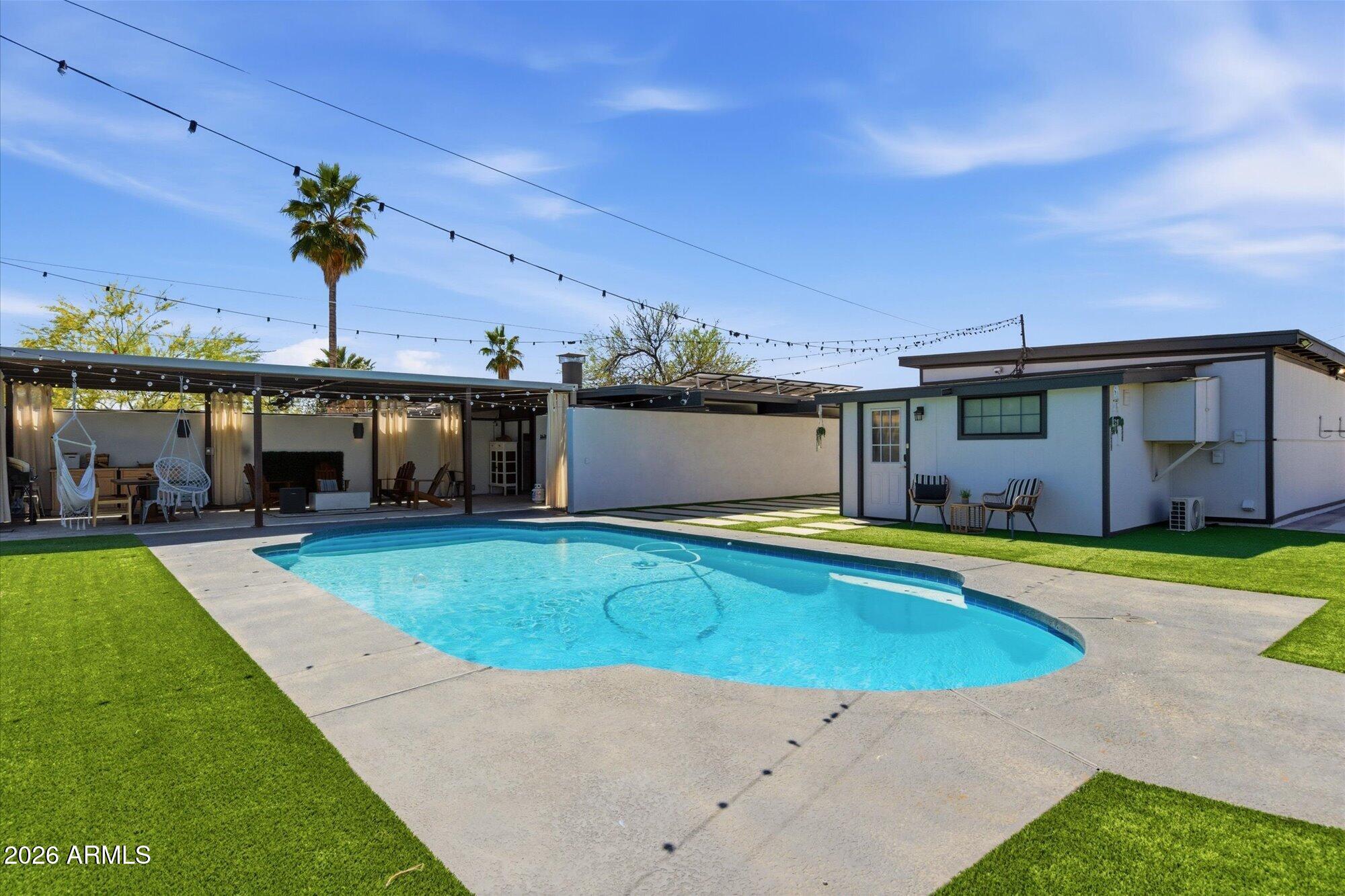 3020 East Wethersfield Road Phoenix, AZ 85032 - Photo 8 of 46 a view of a house with a swimming pool