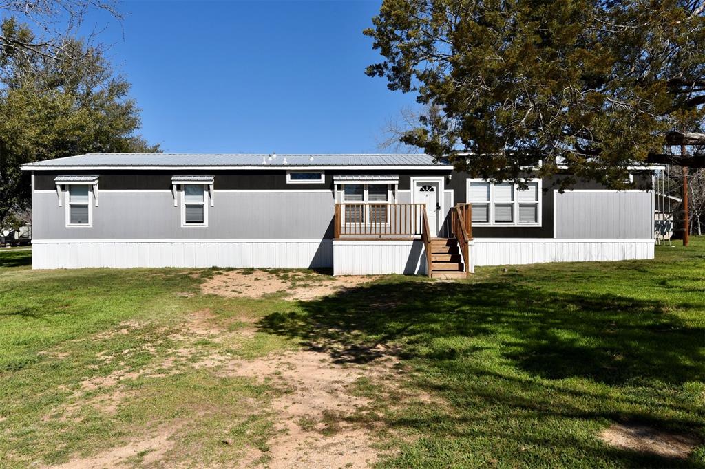 201 Rock Creek Road, Unit 59 Graford, TX 76449 - Photo 1 of 1 a front view of a house with garden