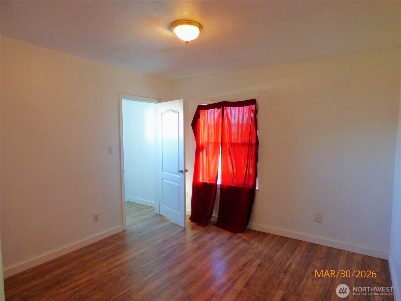 615 Haight Street Aberdeen, WA 98520 - Photo 11 of 18 an empty room with wooden floor and closet