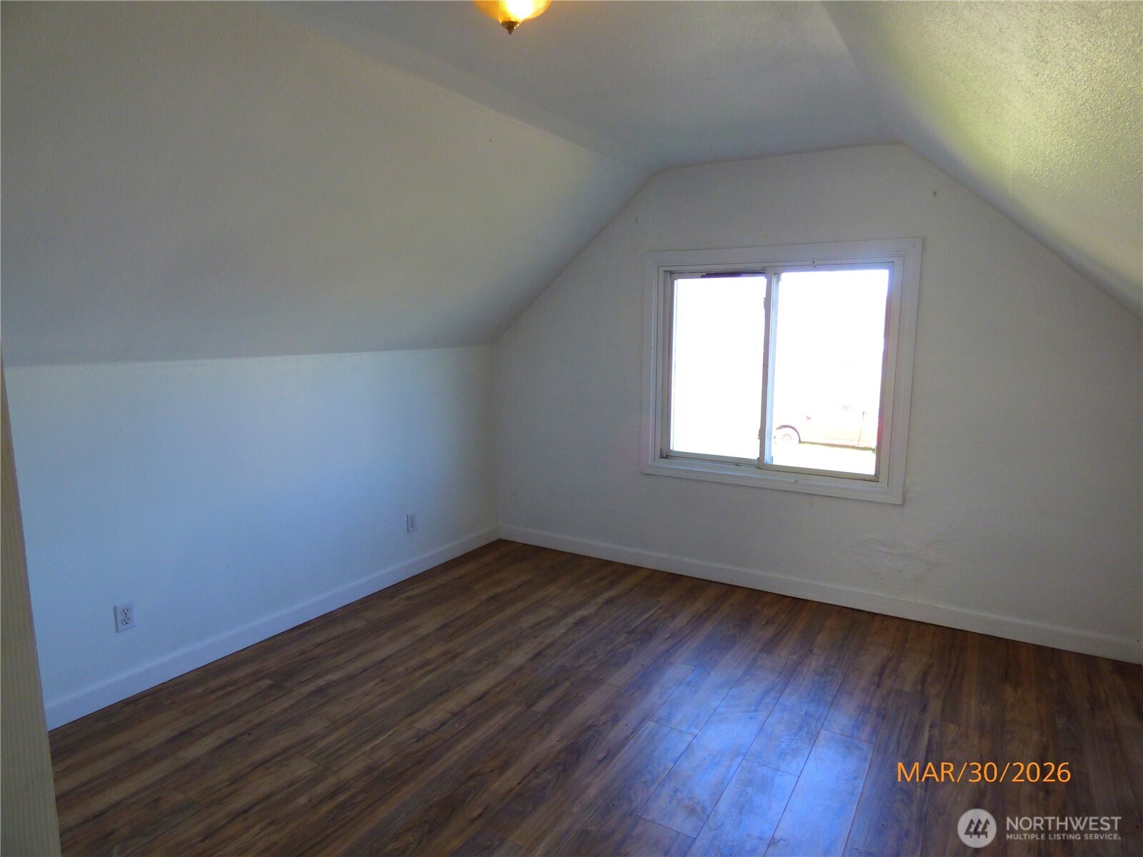 615 Haight Street Aberdeen, WA 98520 - Photo 15 of 18 an empty room with wooden floor and windows