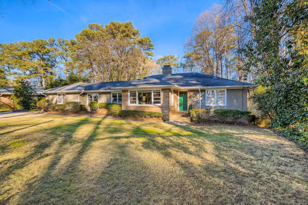 1271 Moores Mill Road Northwest Atlanta, GA 30327 - Photo 1 of 1 a view of a house with a yard