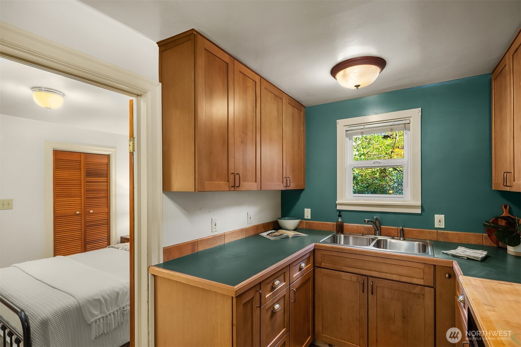 548 Northeast 102nd Street Seattle, WA 98125 - Photo 16 of 27 a kitchen that has a sink and a stove in it