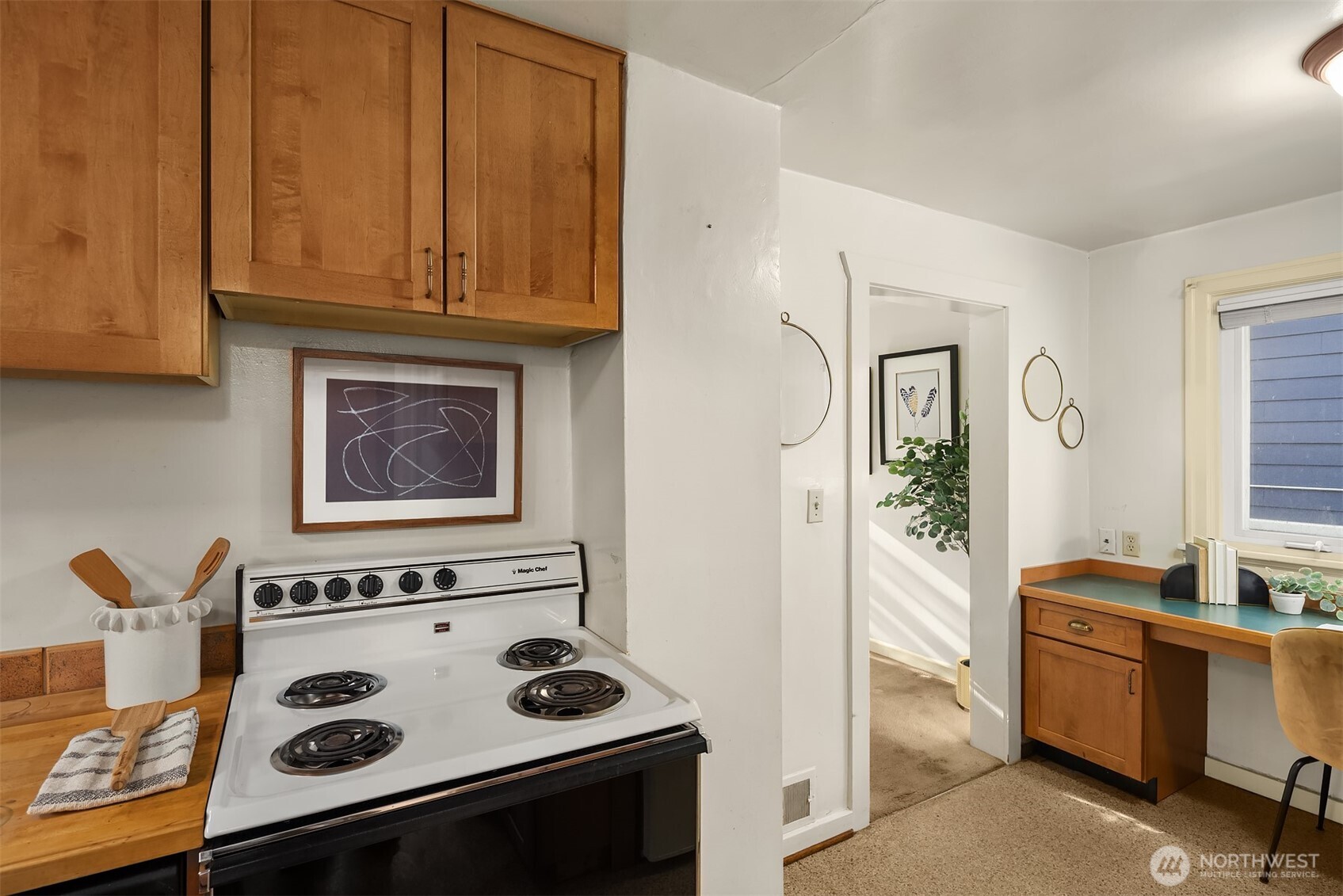 548 Northeast 102nd Street Seattle, WA 98125 - Photo 17 of 27 a kitchen with a stove and a microwave
