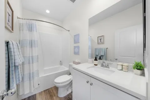 a bedroom with bed and a chandelier