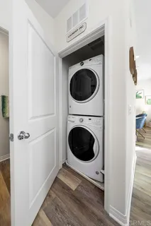 a view of a hallway with washer and dryer