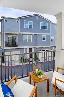 a view of a balcony and chairs