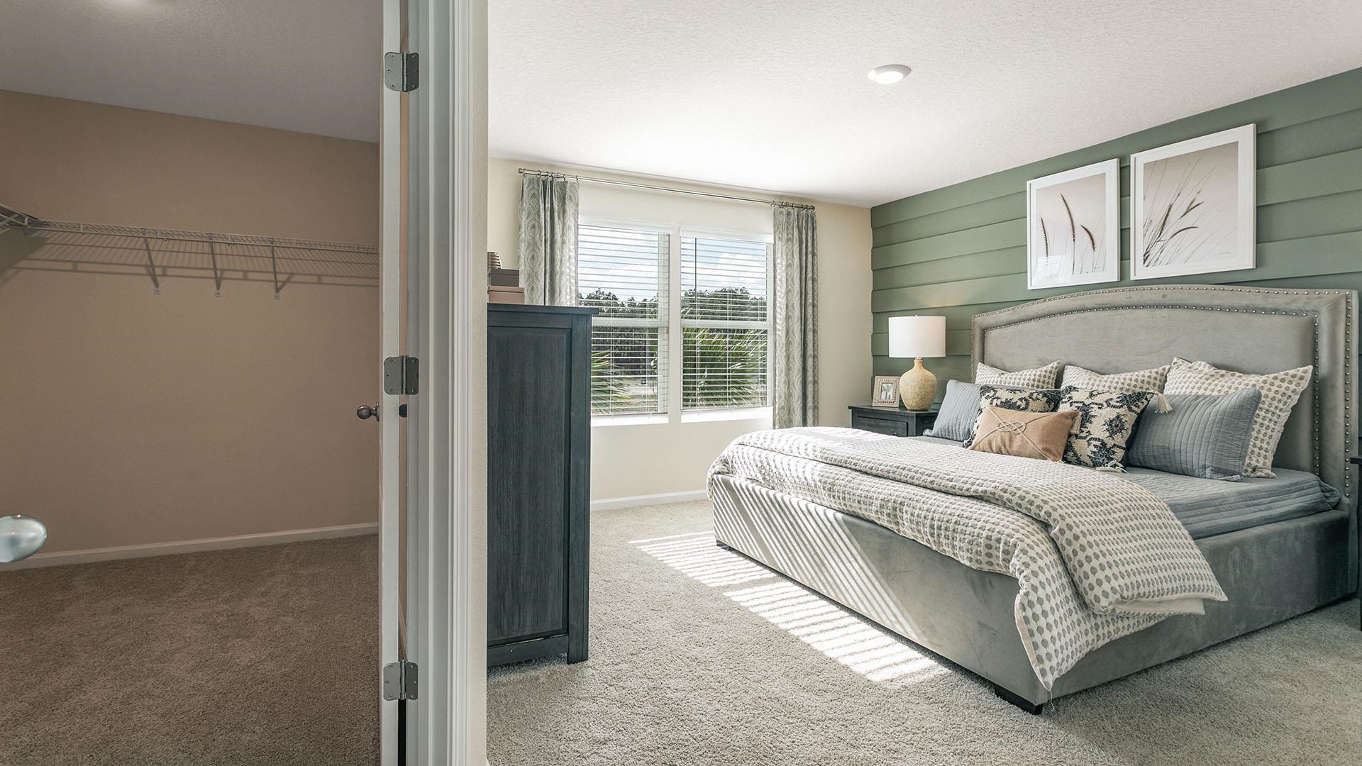 155 Redbud Road Palm Coast, FL 32137 - Photo 18 of 39 a bedroom with a bed and a window