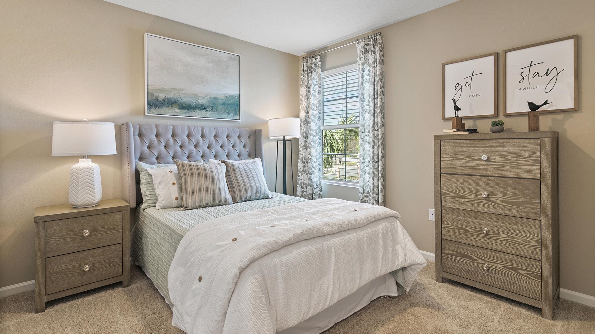 155 Redbud Road Palm Coast, FL 32137 - Photo 20 of 39 a bedroom with a bed and a mirror