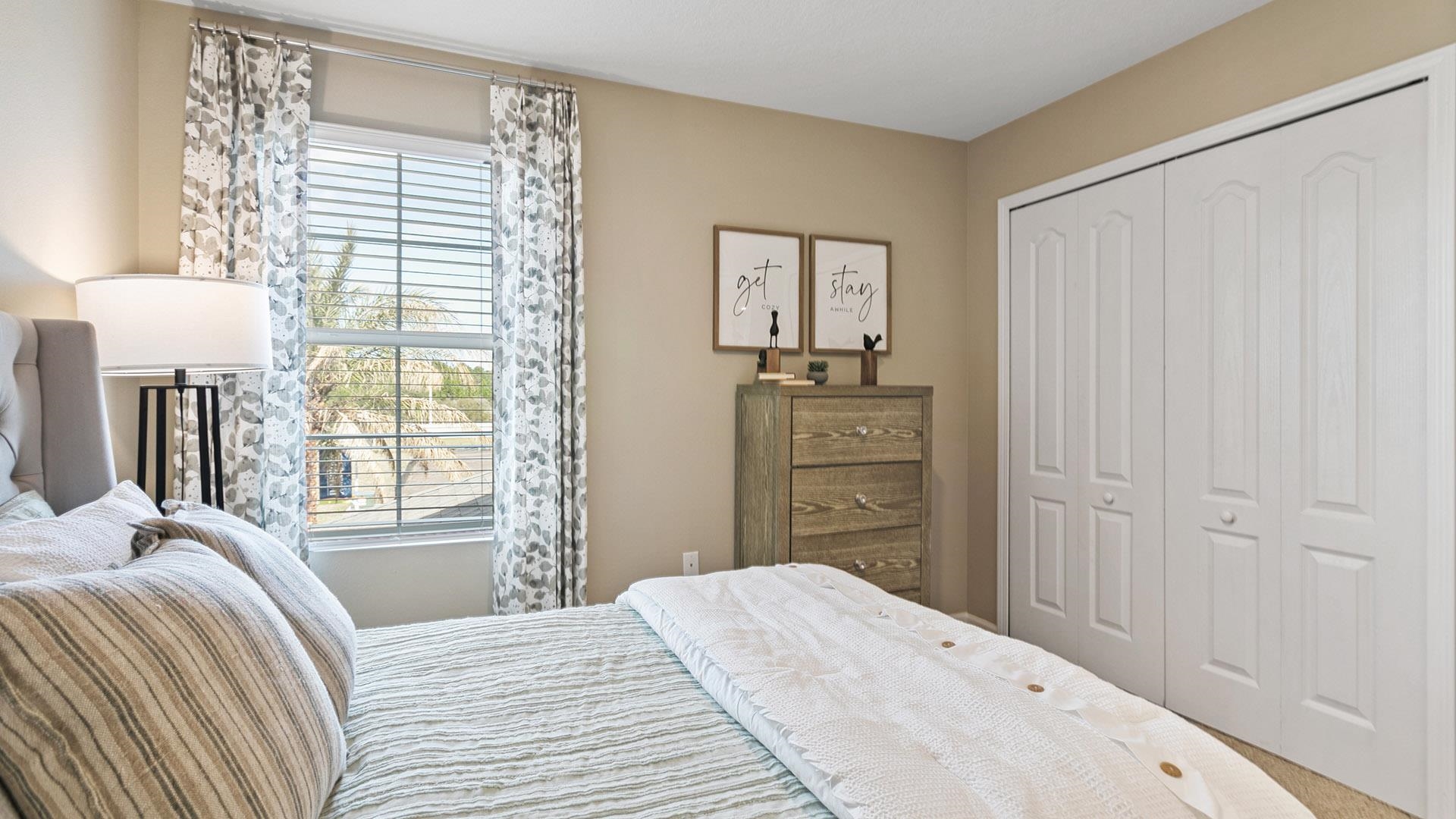 155 Redbud Road Palm Coast, FL 32137 - Photo 21 of 39 a bedroom with a bed and a window