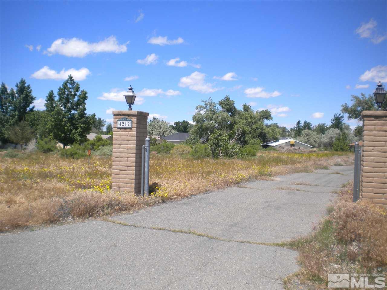 4290 Alcorn Road Fallon, NV 89406 - Photo 1 of 1 a view of a lake with a yard