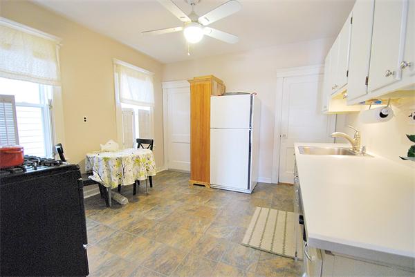 40 Parkton Road, Unit 2 Boston, MA 02130 - Photo 11 of 20 a bedroom with furniture and a chandelier