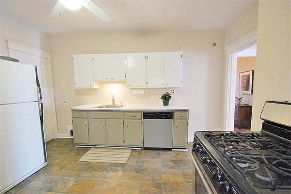40 Parkton Road, Unit 2 Boston, MA 02130 - Photo 9 of 20 a kitchen with granite countertop a sink stove and refrigerator
