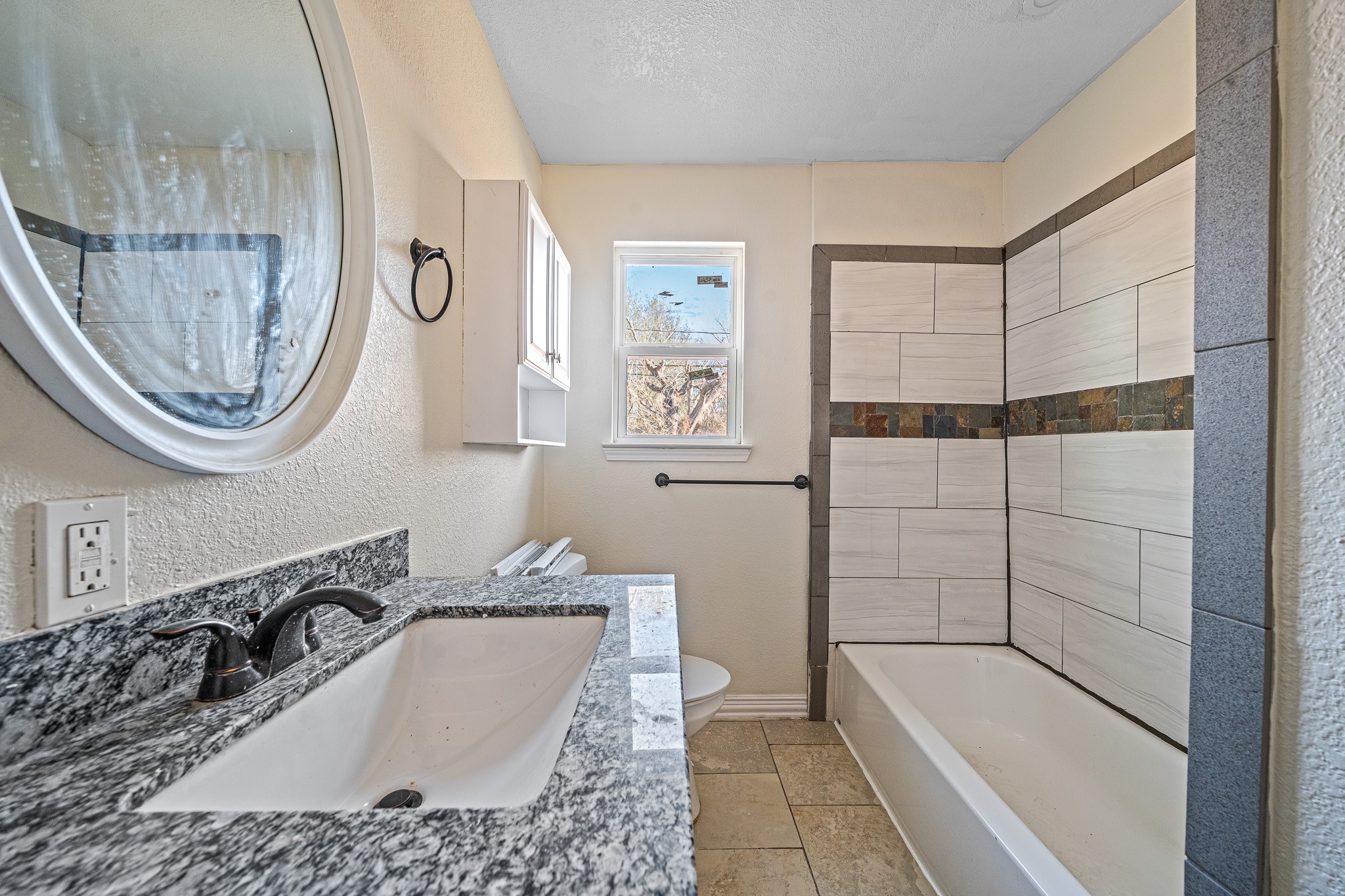 6911 Sherwood Drive Houston, TX 77021 - Photo 13 of 26 a bathroom with a tub a sink and a shower