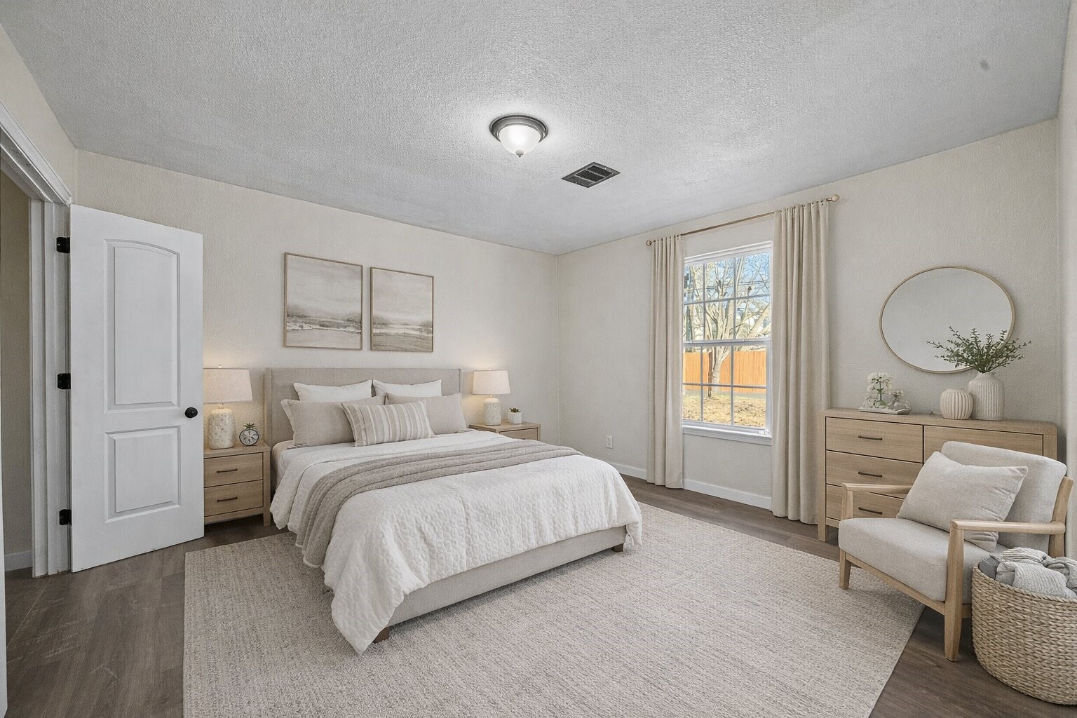 6911 Sherwood Drive Houston, TX 77021 - Photo 14 of 26 a bedroom with a bed a mirror and a window