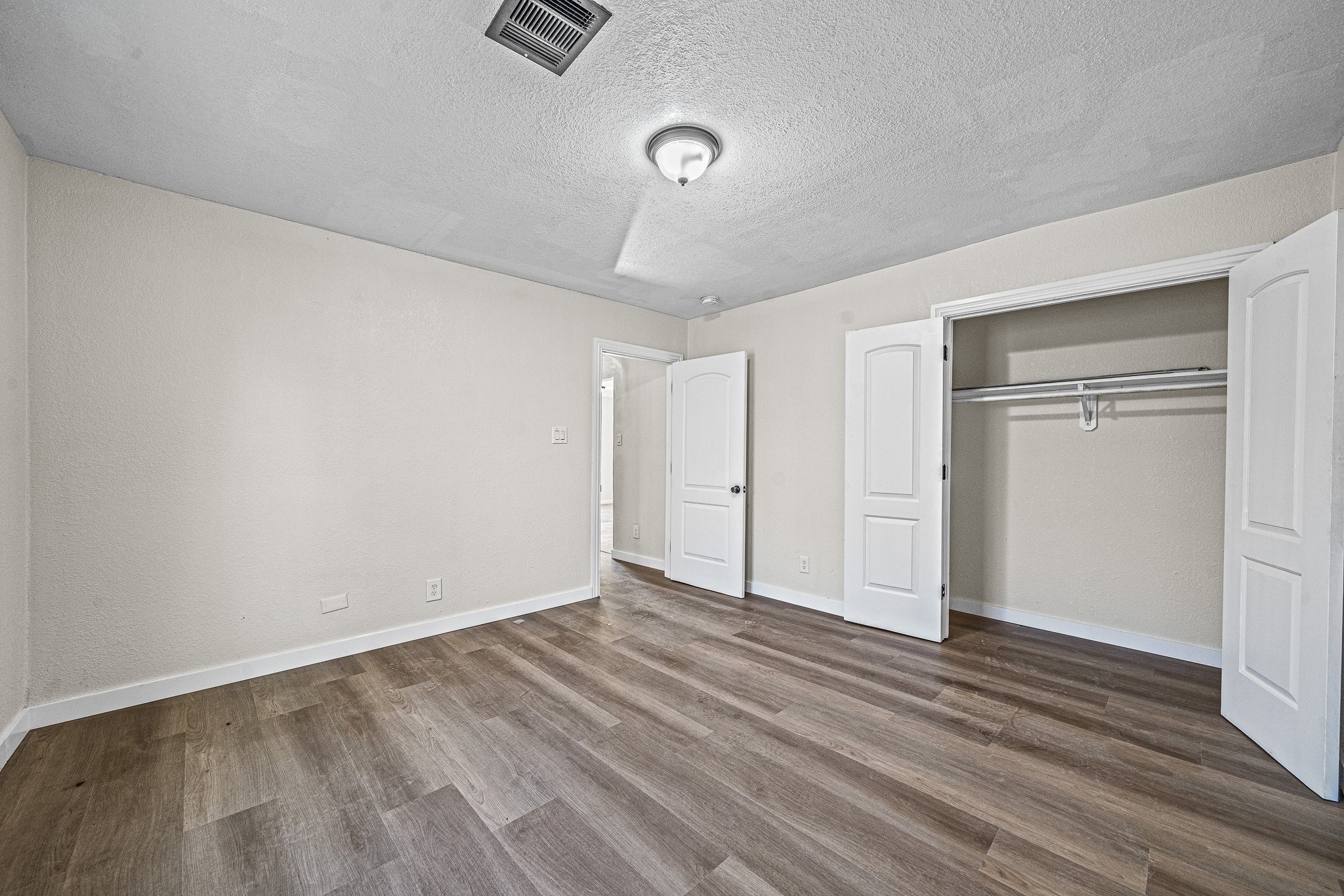 6911 Sherwood Drive Houston, TX 77021 - Photo 16 of 26 a view of an empty room with wooden floor
