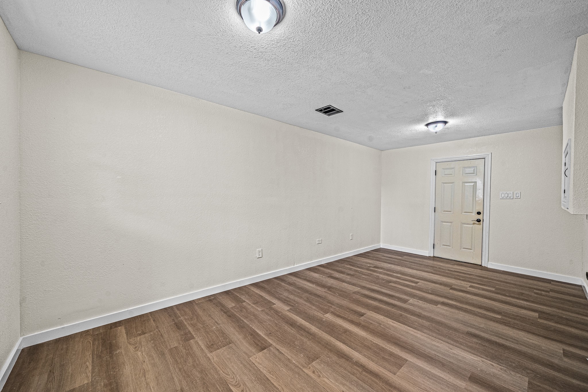 6911 Sherwood Drive Houston, TX 77021 - Photo 17 of 26 a view of an empty room with wooden floor