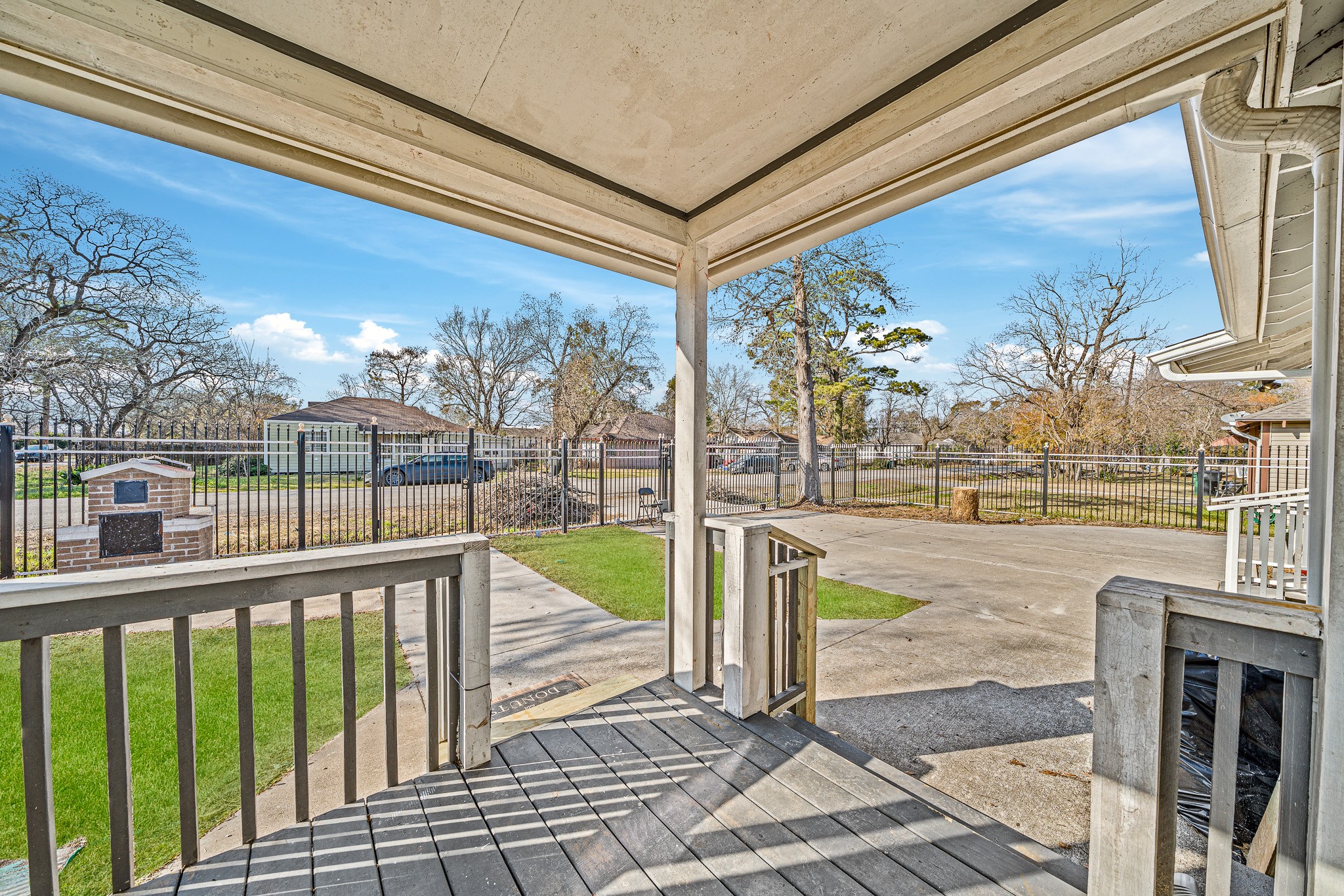 6911 Sherwood Drive Houston, TX 77021 - Photo 5 of 26 a view of a balcony with floor to ceiling windows wooden floor