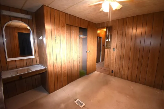 a view of an entryway with a chandelier fan