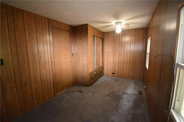 a view of an empty room with windows