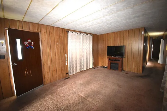 a view of livingroom with furniture and flat screen tv