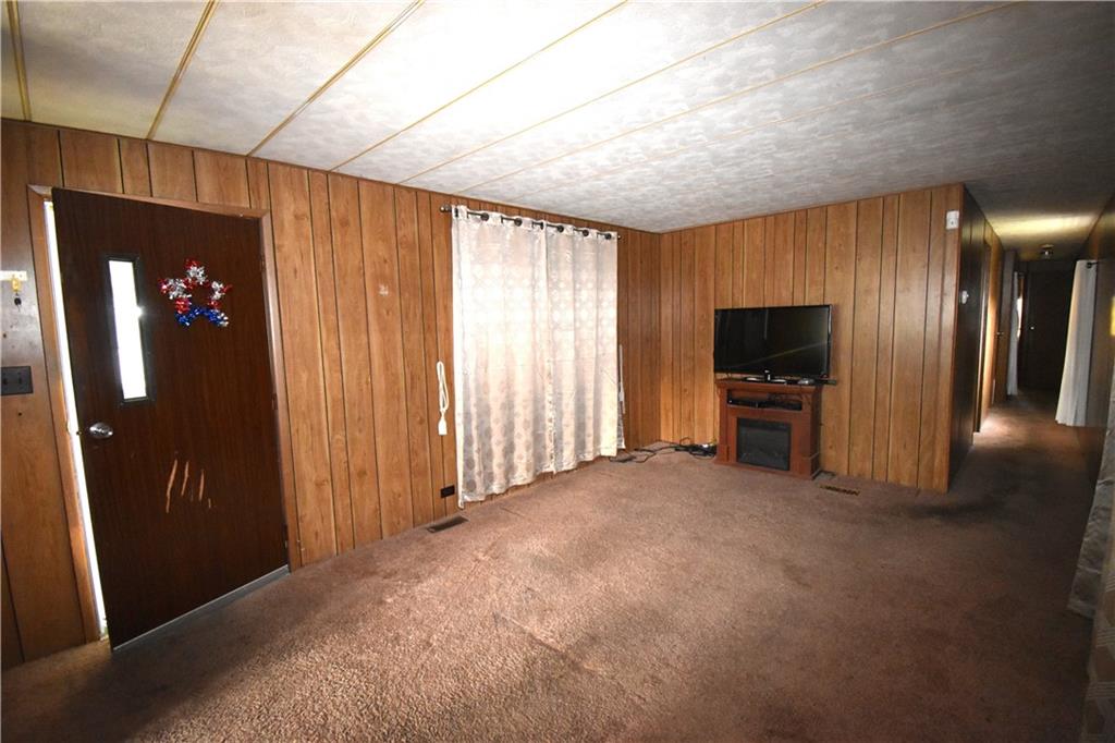 44 Concord Circle Freedom, PA 15042 - Photo 7 of 15 a view of livingroom with furniture and flat screen tv