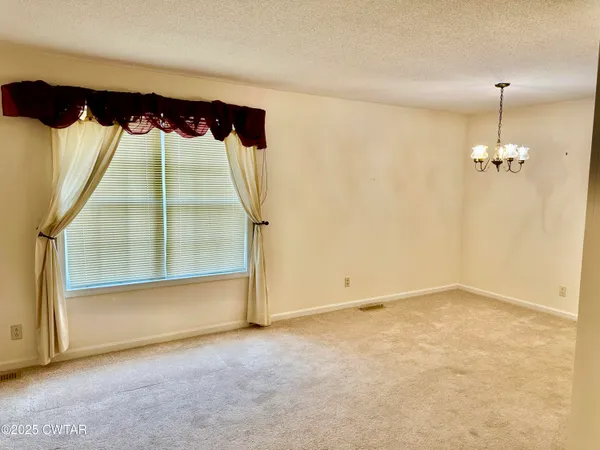 en view of an empty room with a window