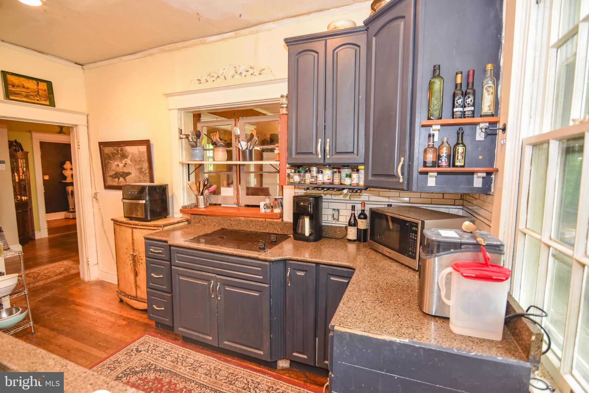 24 Merrymount Road Baltimore, MD 21210 - Photo 8 of 48 a kitchen with stainless steel appliances granite countertop a stove and a refrigerator