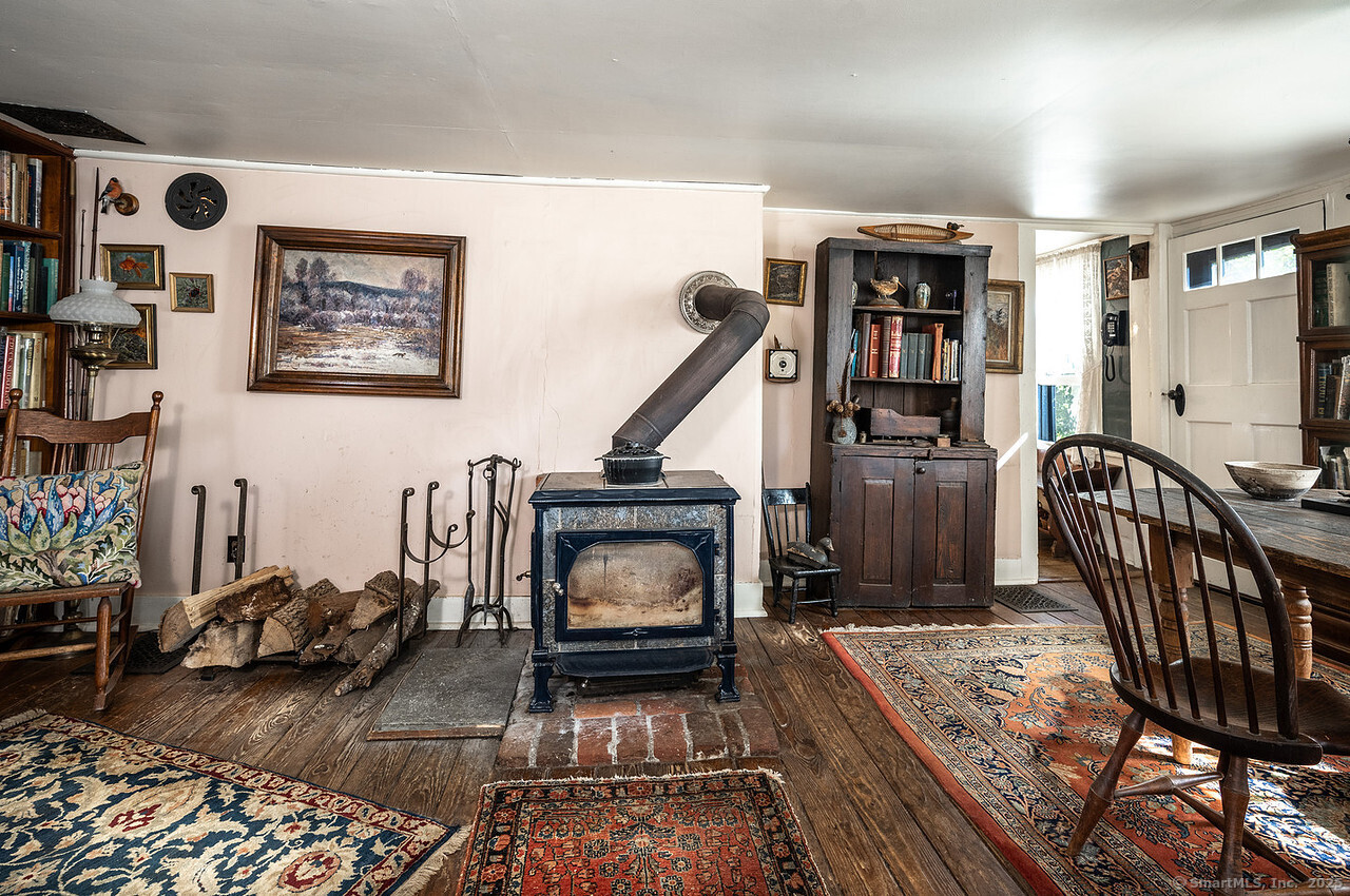 143 Whitcomb Hill Road Cornwall, CT 06754 - Photo 11 of 40 a living room with furniture and a wooden floor