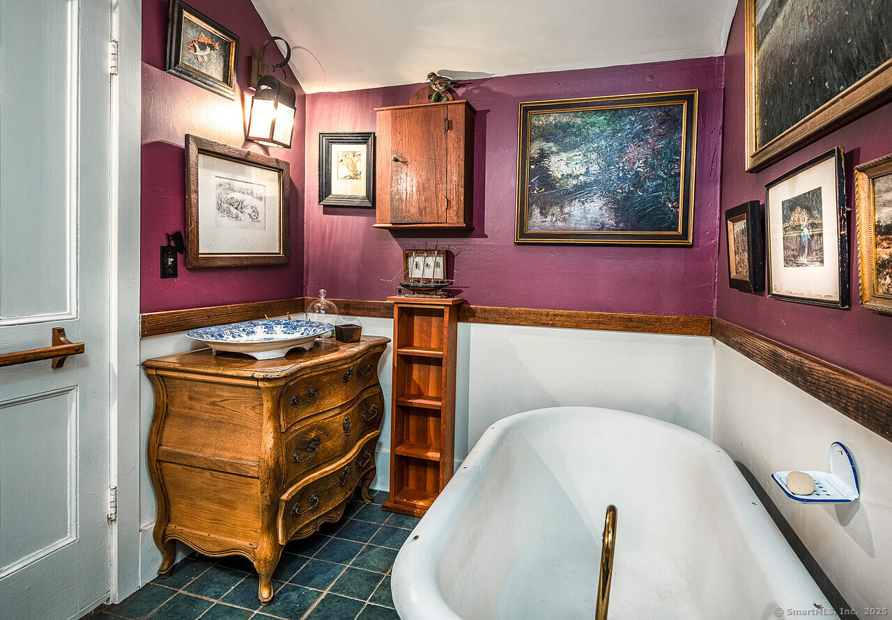 143 Whitcomb Hill Road Cornwall, CT 06754 - Photo 18 of 40 a room with furniture and paintings on the wall