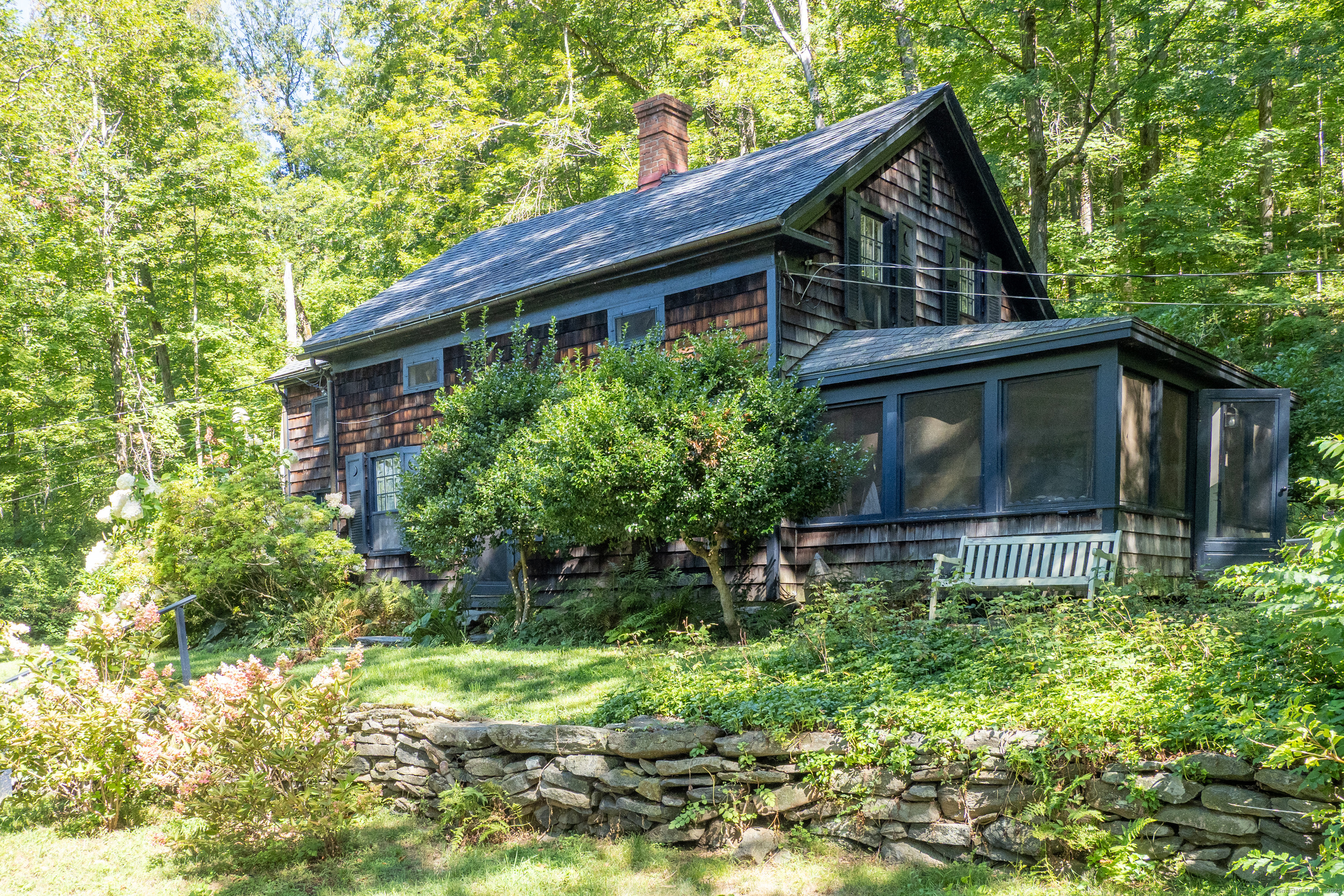 143 Whitcomb Hill Road Cornwall, CT 06754 - Photo 2 of 40 a house with a big yard and large trees