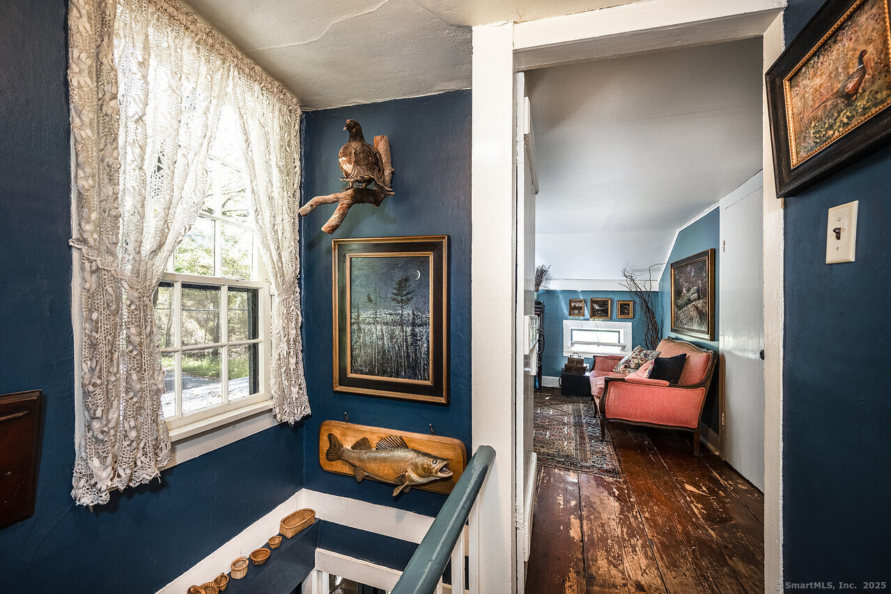 143 Whitcomb Hill Road Cornwall, CT 06754 - Photo 22 of 40 a living room with furniture and a window