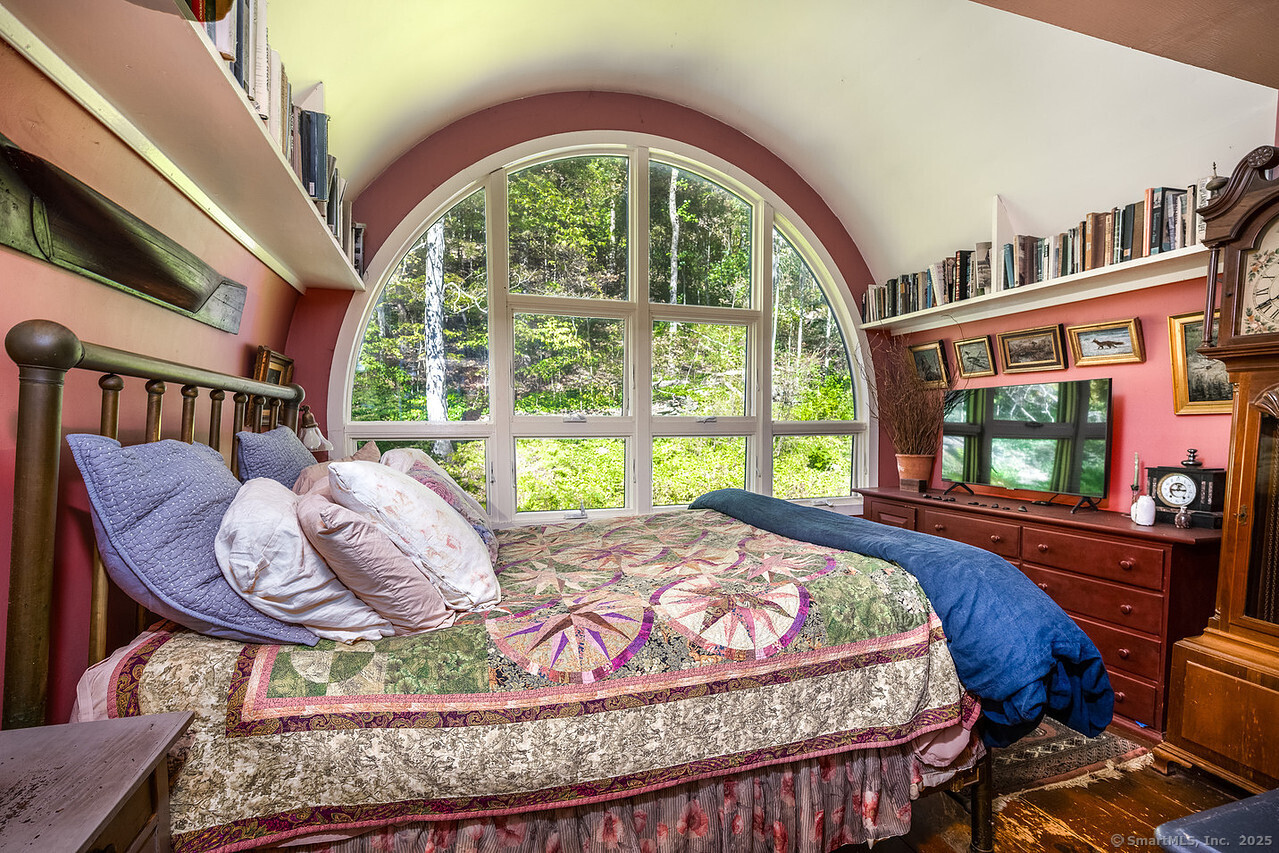 143 Whitcomb Hill Road Cornwall, CT 06754 - Photo 23 of 40 a bed sitting in a bedroom next to a window