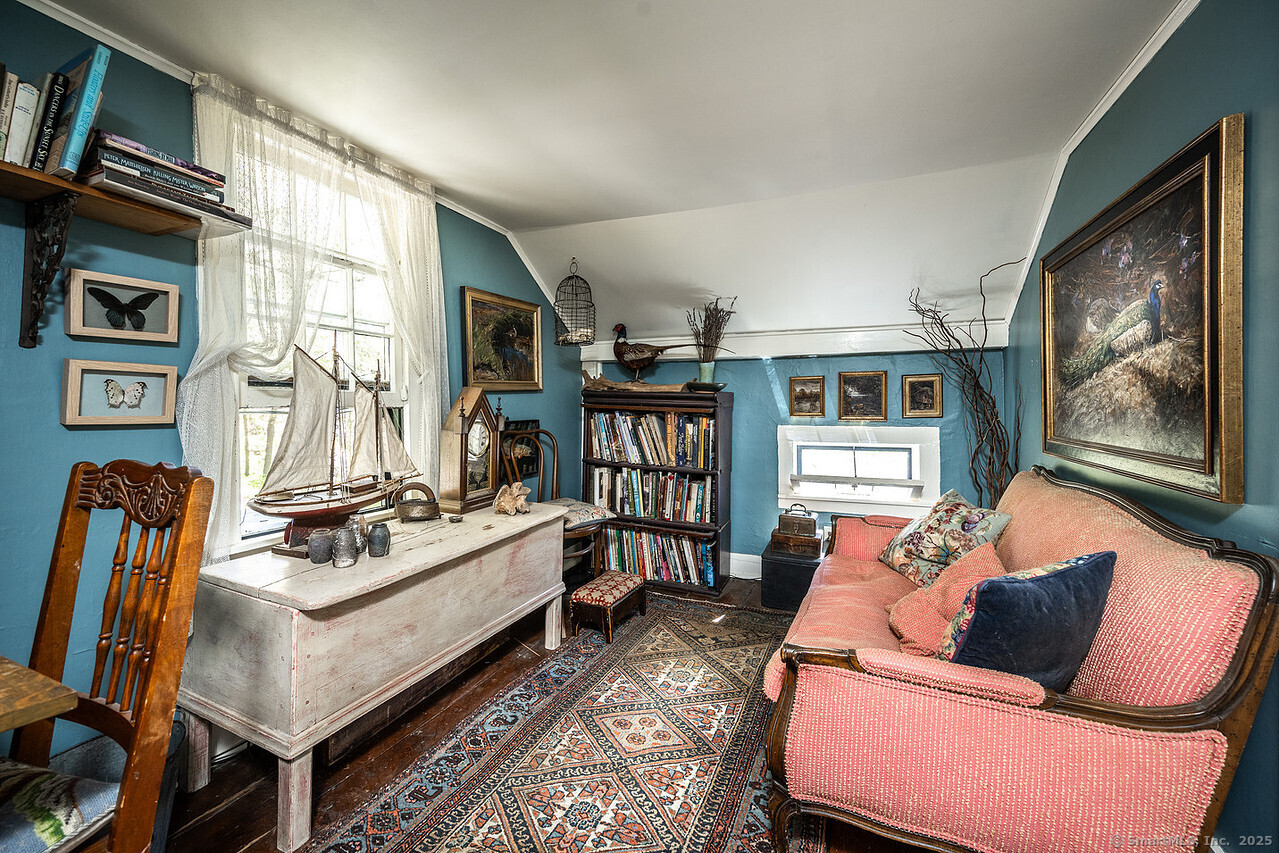 143 Whitcomb Hill Road Cornwall, CT 06754 - Photo 27 of 40 a living room with furniture a flat screen tv and a couch