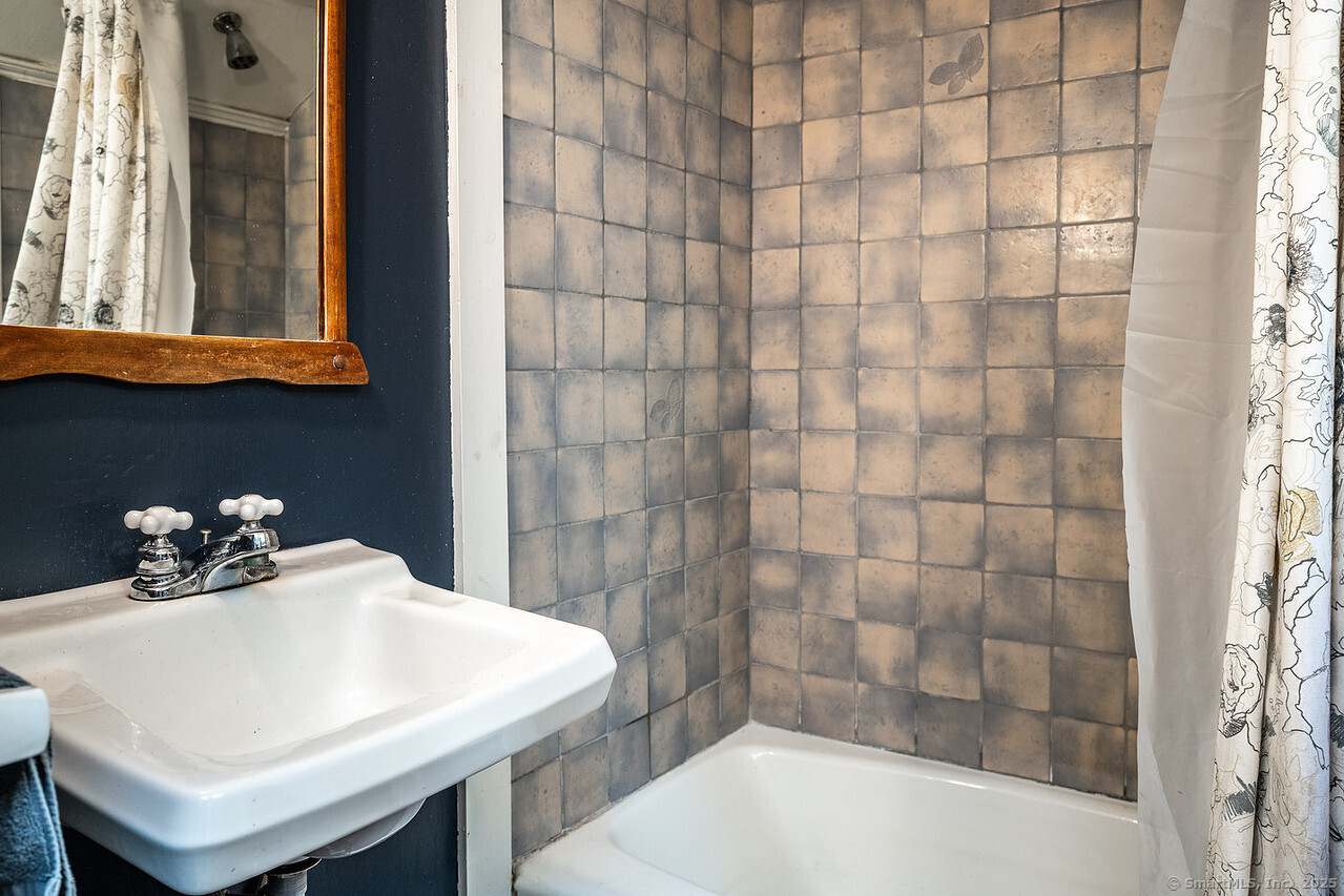 143 Whitcomb Hill Road Cornwall, CT 06754 - Photo 28 of 40 a bathroom with a sink and a bathtub