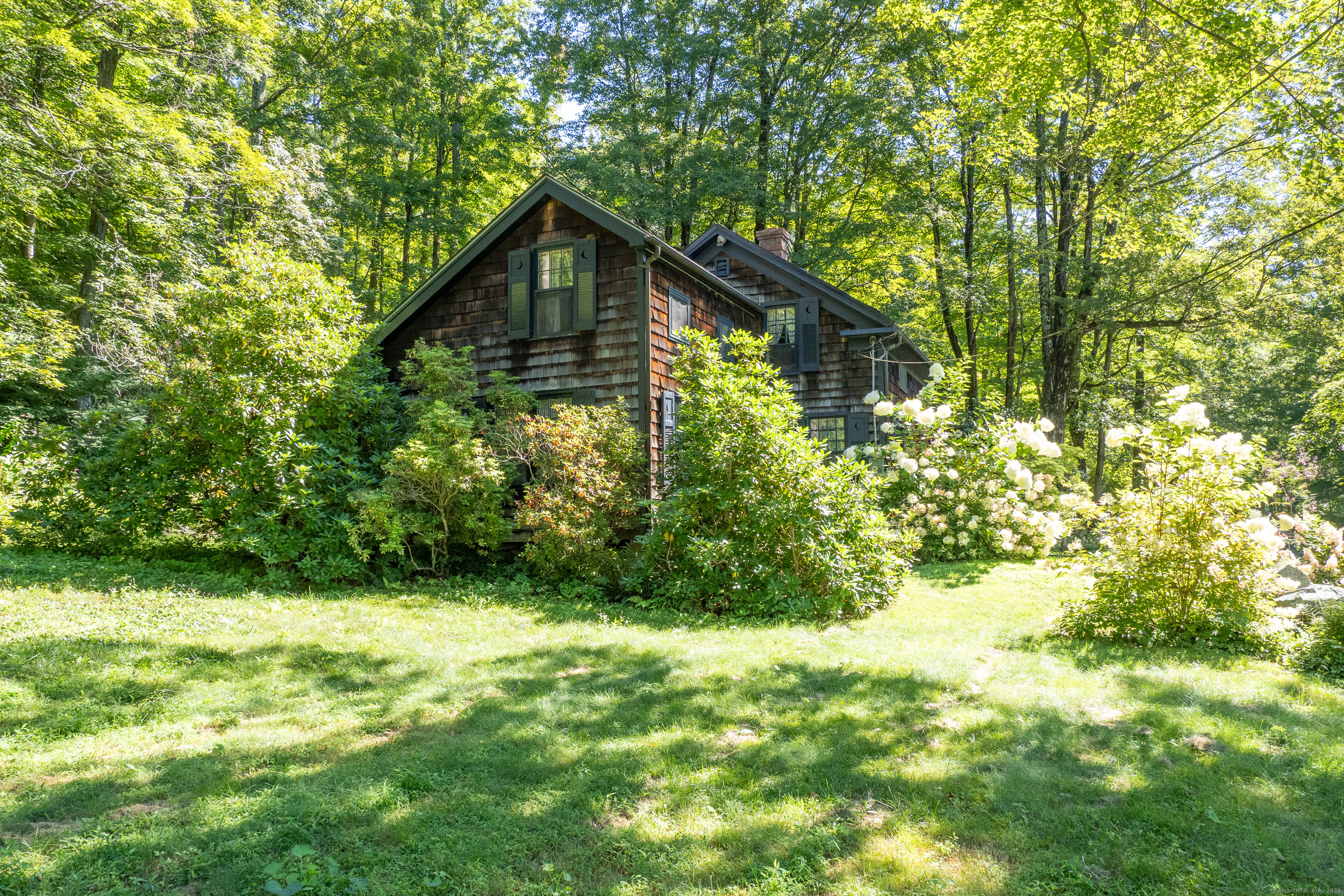 143 Whitcomb Hill Road Cornwall, CT 06754 - Photo 32 of 40 a view of a house with a yard