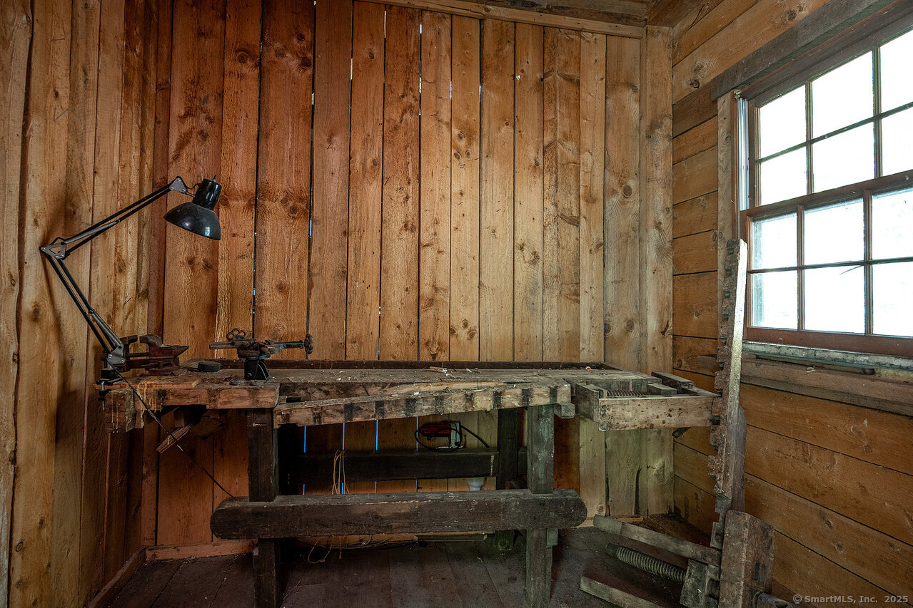 143 Whitcomb Hill Road Cornwall, CT 06754 - Photo 38 of 40 a bathroom with a sink and a window