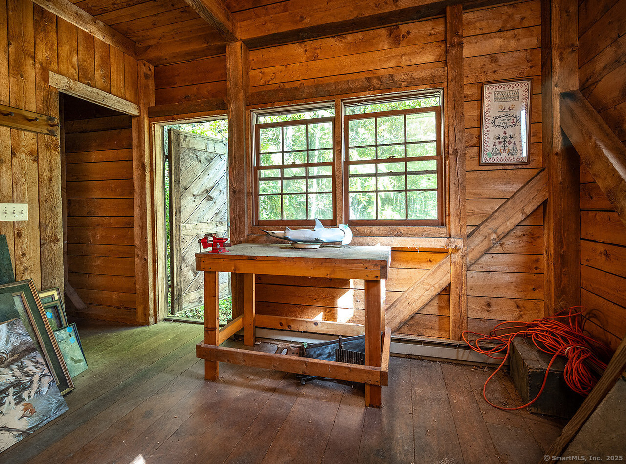 143 Whitcomb Hill Road Cornwall, CT 06754 - Photo 40 of 40 a room with wooden floor and a window