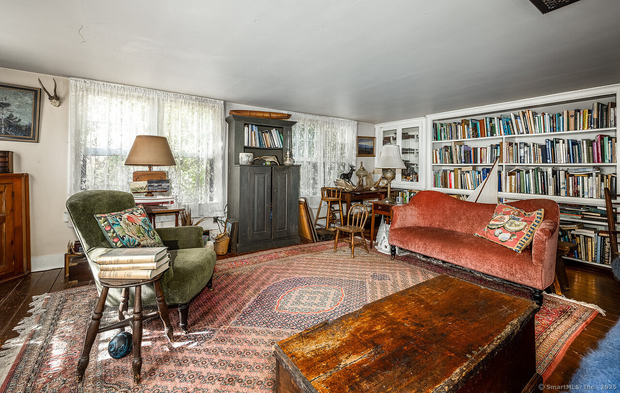 143 Whitcomb Hill Road Cornwall, CT 06754 - Photo 7 of 40 a living room with furniture and a wooden floor