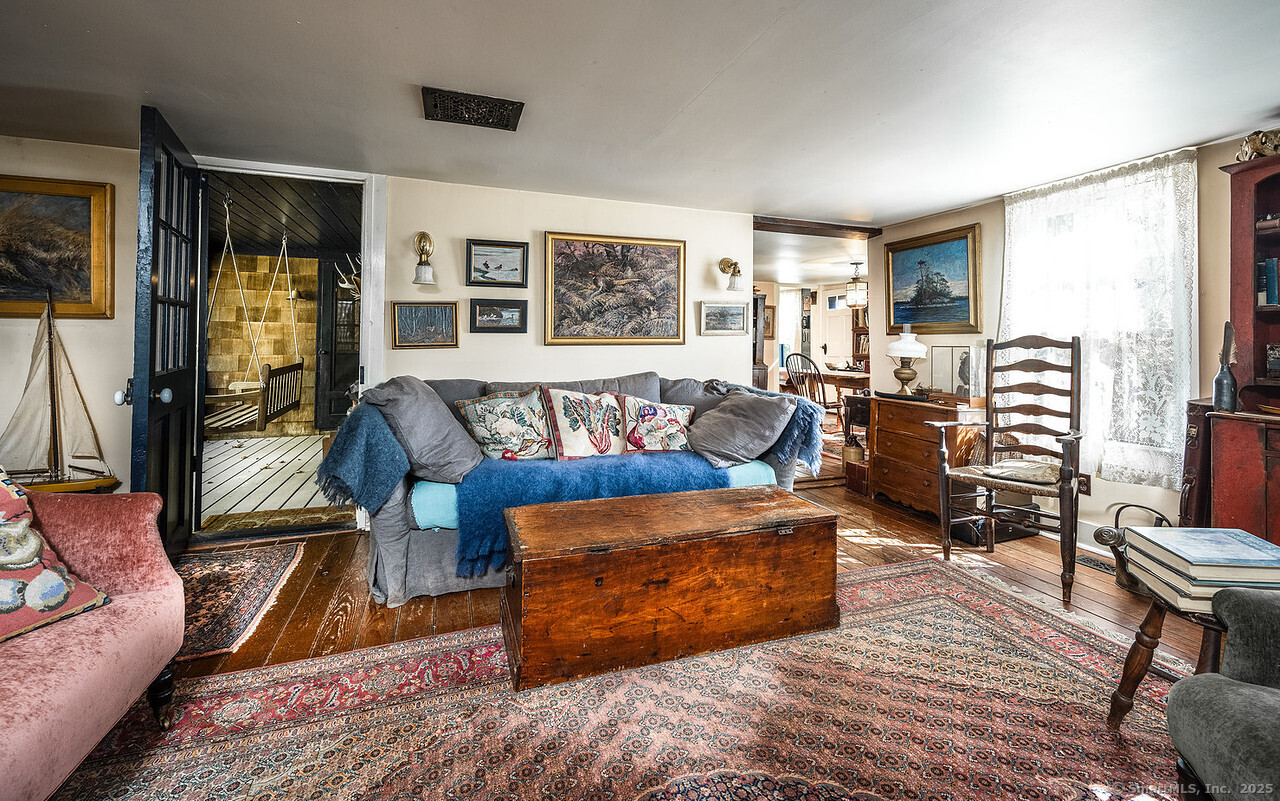 143 Whitcomb Hill Road Cornwall, CT 06754 - Photo 8 of 40 a living room with furniture and a rug