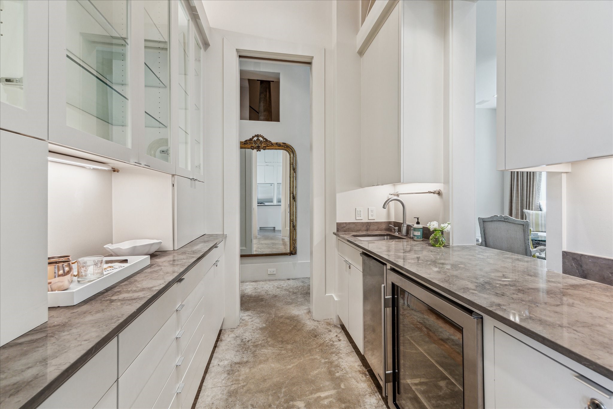 6107 Crab Orchard Road Houston, TX 77057 - Photo 15 of 42 a large kitchen with granite countertop a sink and a stove
