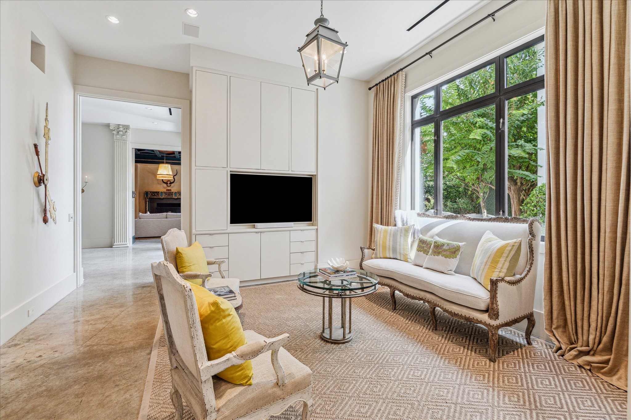 6107 Crab Orchard Road Houston, TX 77057 - Photo 16 of 42 a living room with furniture a flat screen tv and a large window