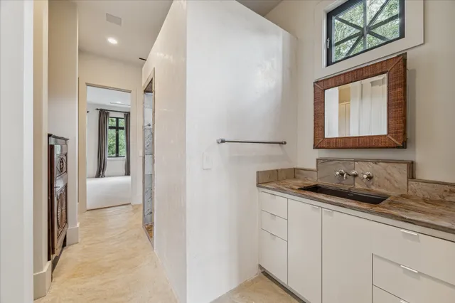 a bathroom with a sink and a mirror