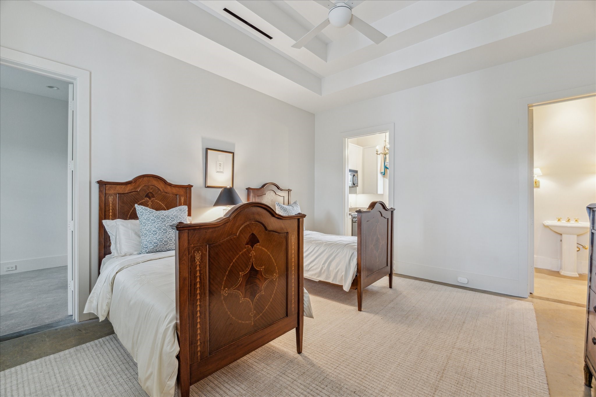 6107 Crab Orchard Road Houston, TX 77057 - Photo 32 of 42 a bedroom with a bed and a chair
