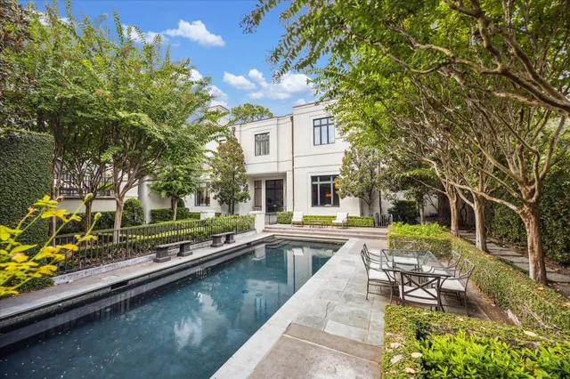 a view of a swimming pool with a patio