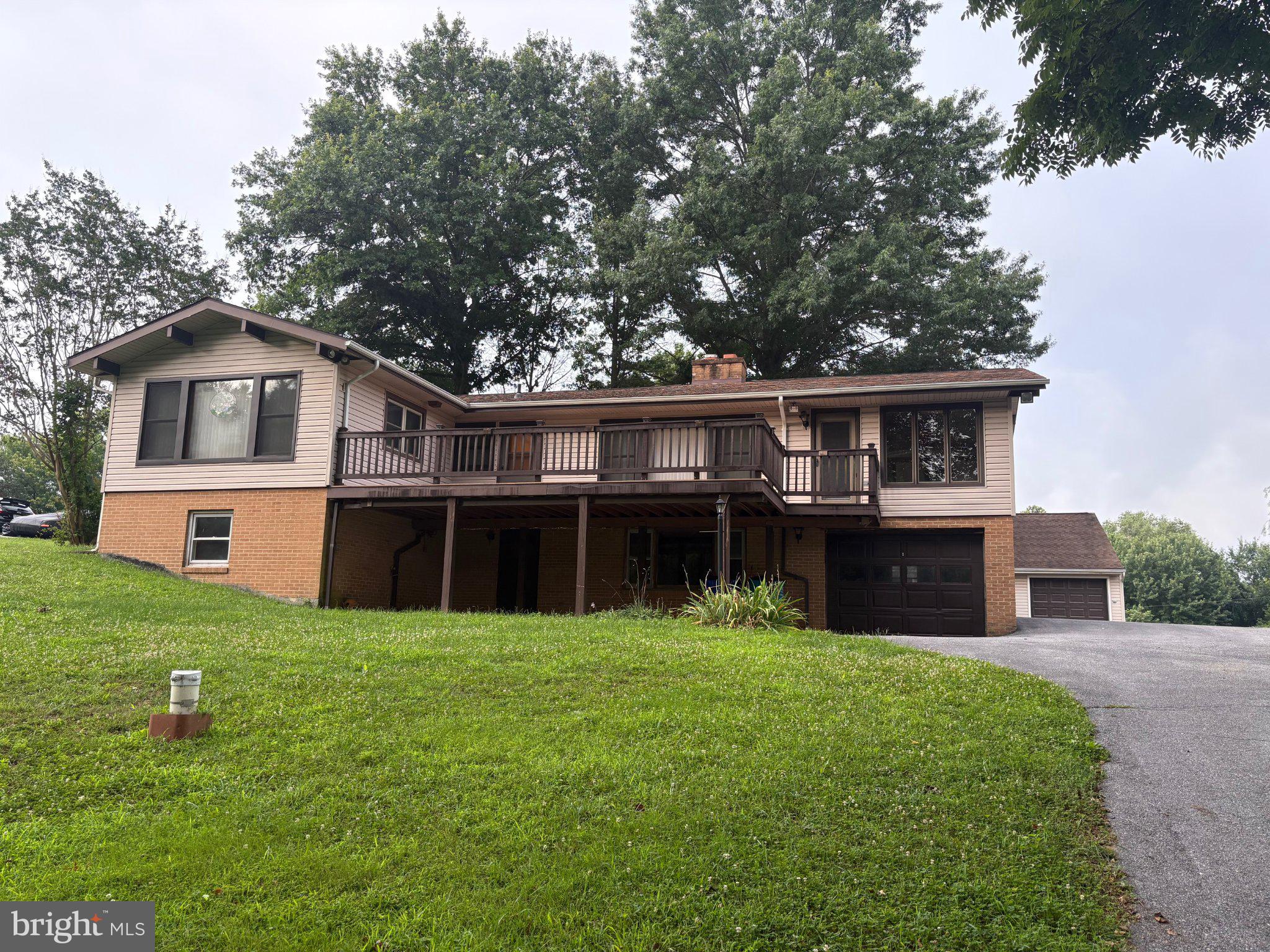 5331 Gold Mine Road Frederick, MD 21703 - Photo 1 of 73 Charming hillside home with lush greenery.
