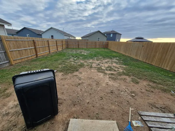 a view of a back yard of the house