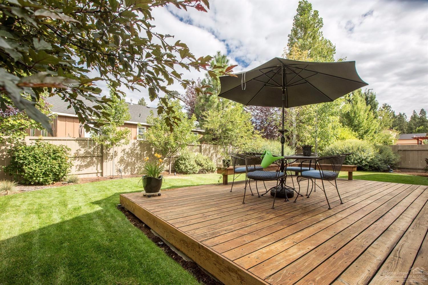 19560 Sager Loop Bend, OR 97702 - Photo 10 of 13 Charming well landscaped backyard and de
