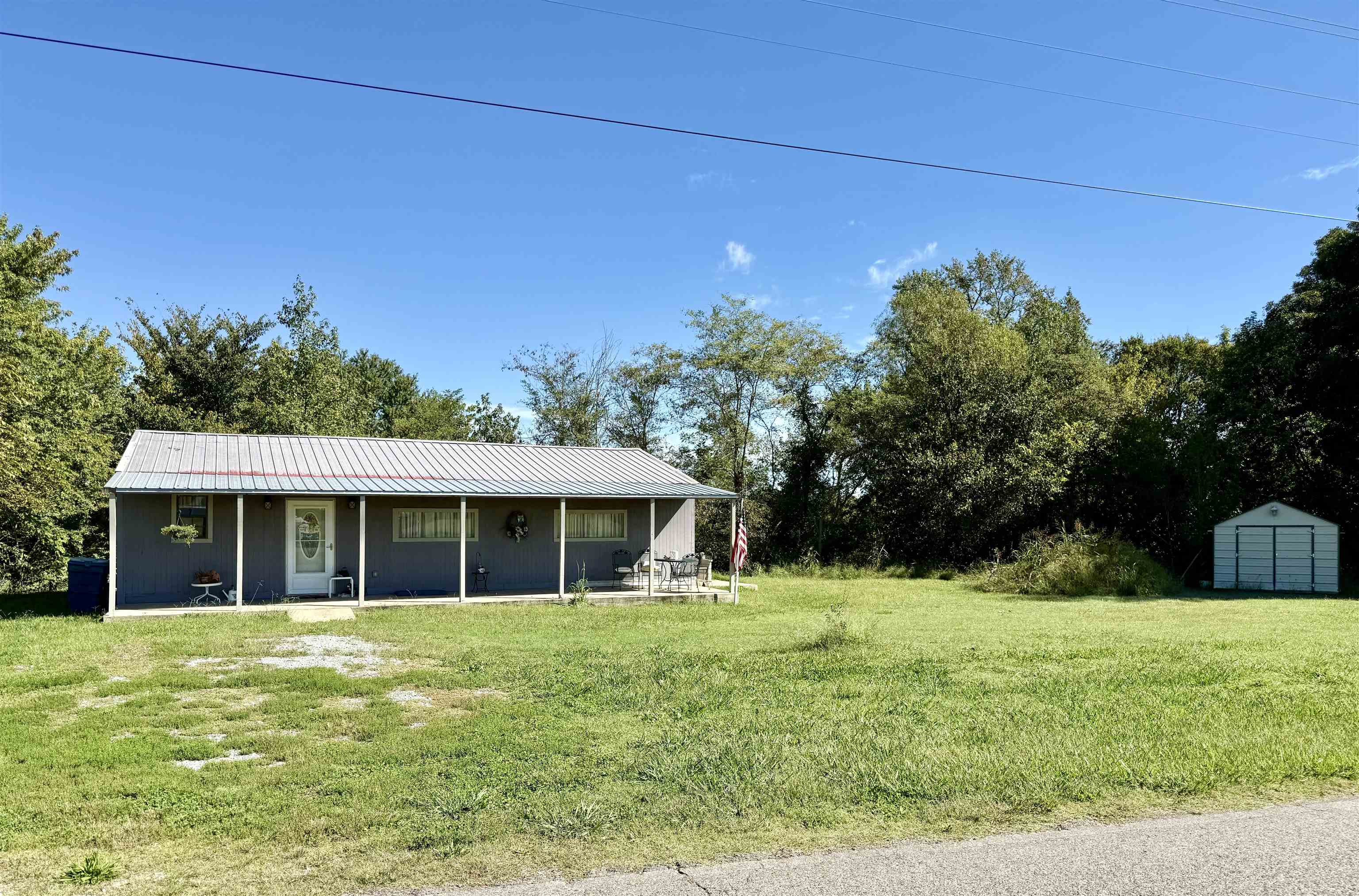 a view of house with yard