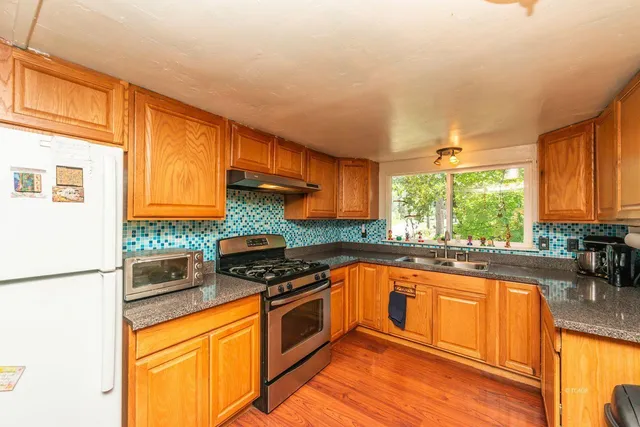 a kitchen with table and chairs