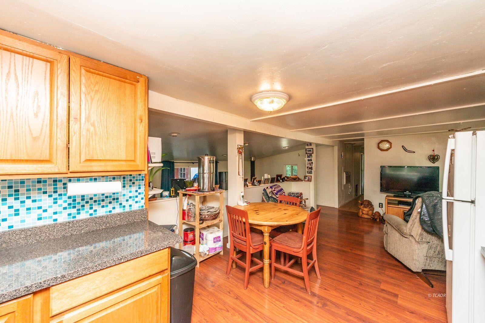 2940 Dutch Creek Road Junction City, CA 96048 - Photo 17 of 47 a view of a dining room with furniture and a window